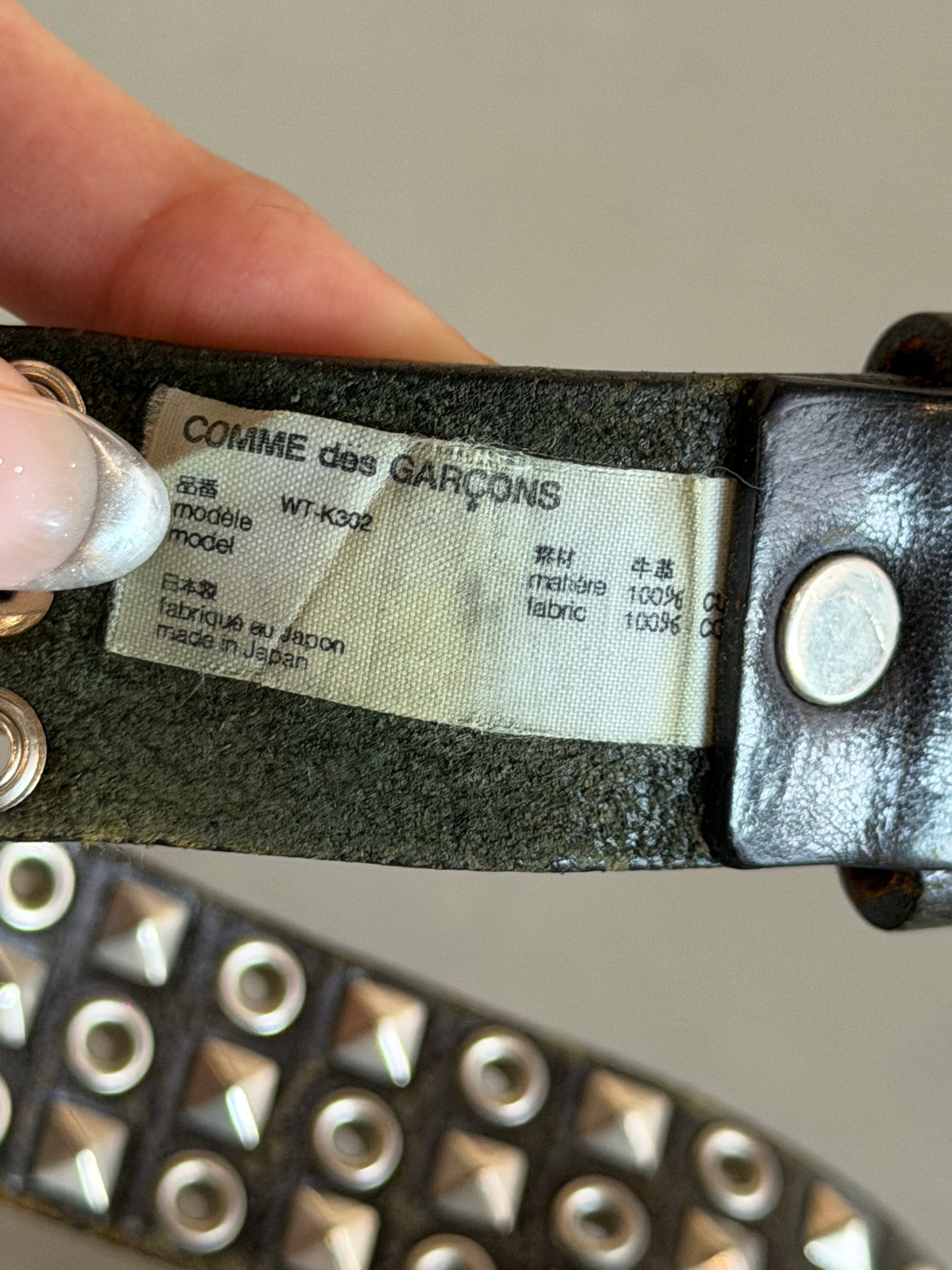 COMME DES GARCONS STUDDED EYELET BELT