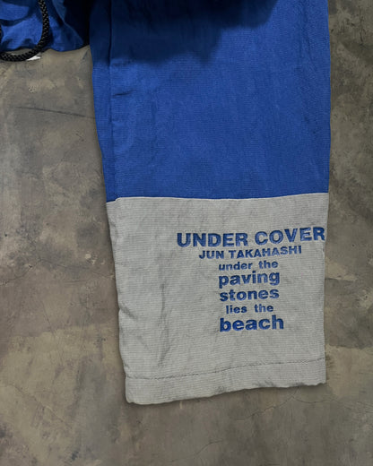 UNDERCOVER SS1995 "UNDER THE PAVING STONES LIES THE BEACH" WINDBREAKER