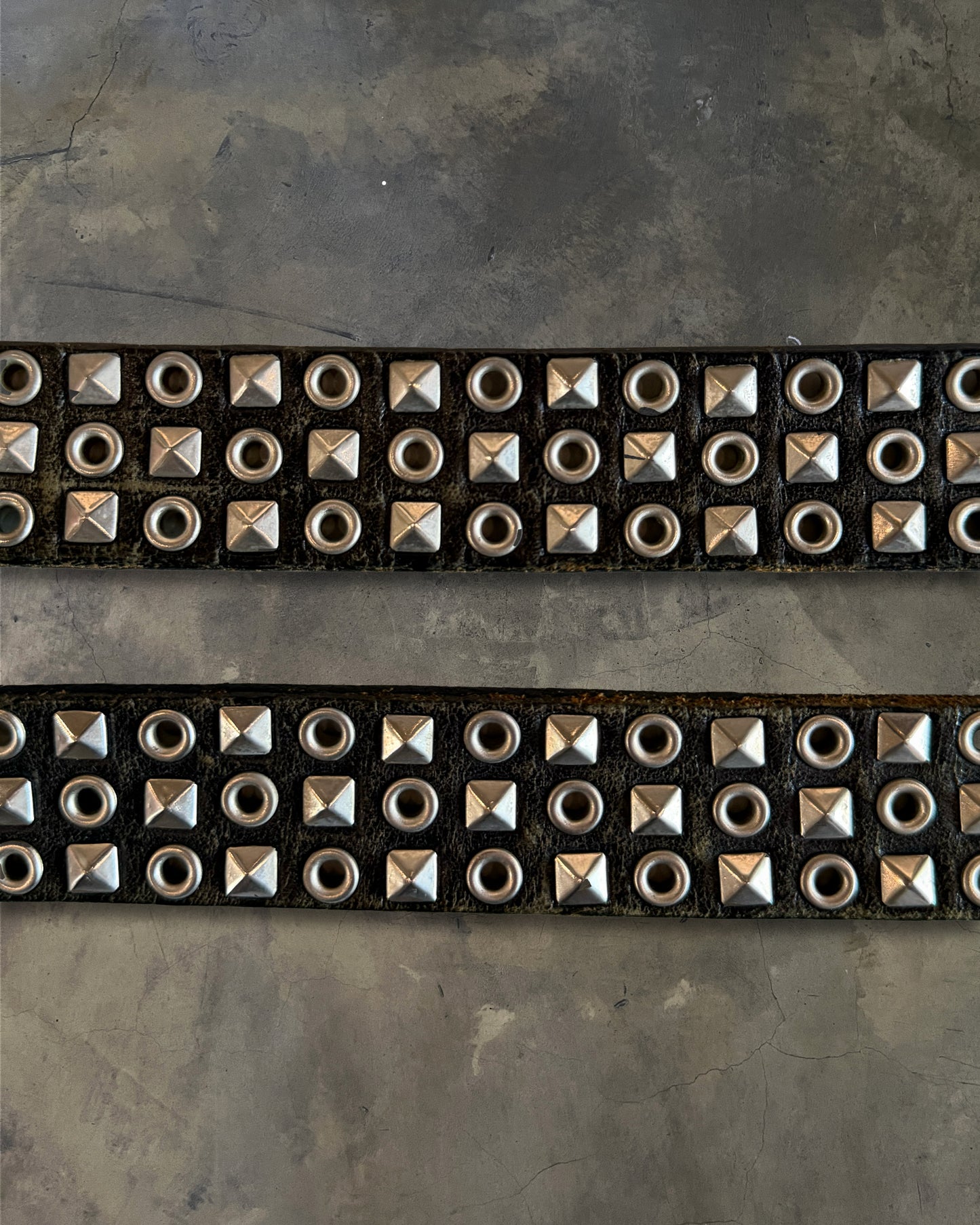 COMME DES GARCONS STUDDED EYELET BELT