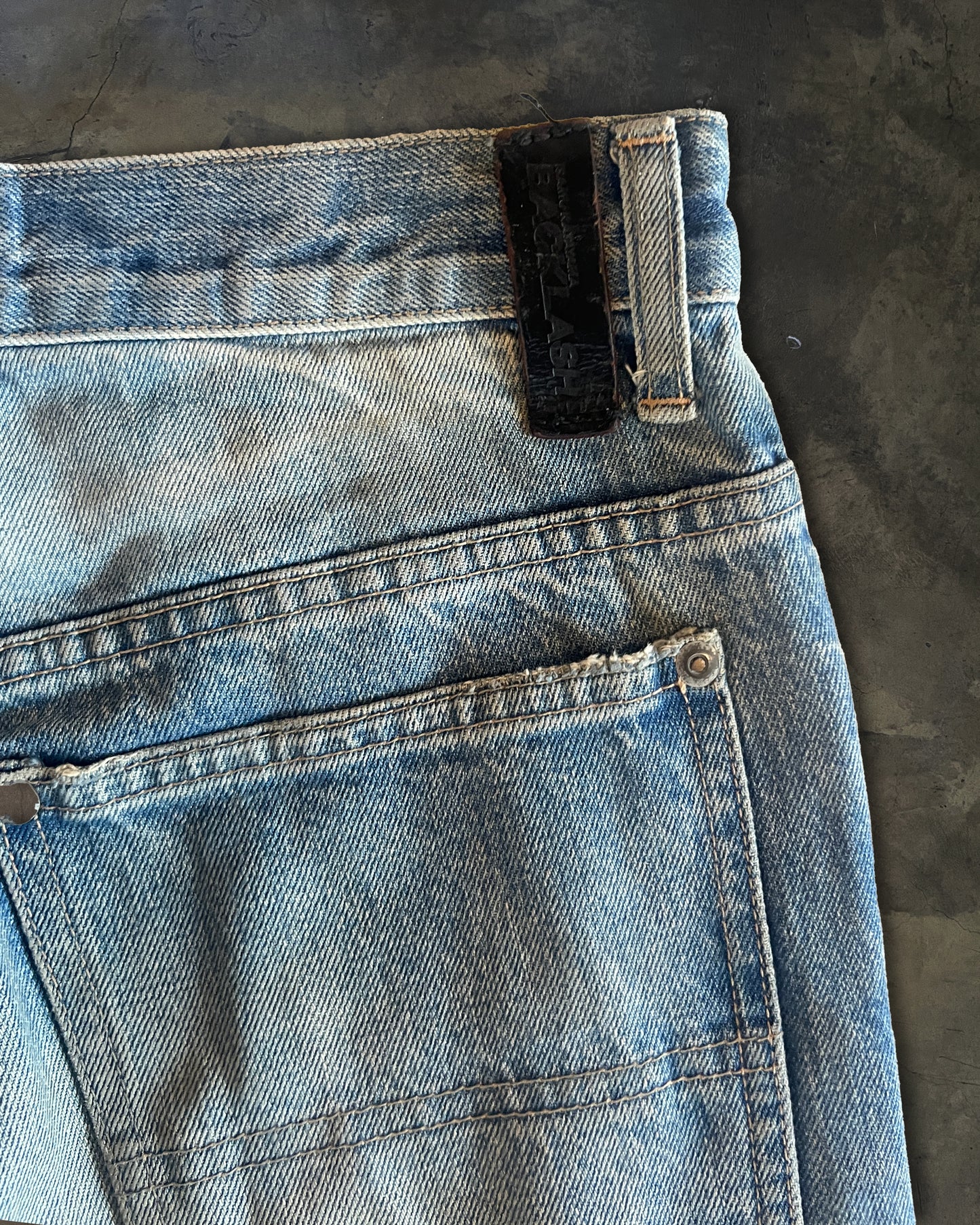 ISAMU KATAYAMA BACKLASH DISTRESSED PATCHED DENIM