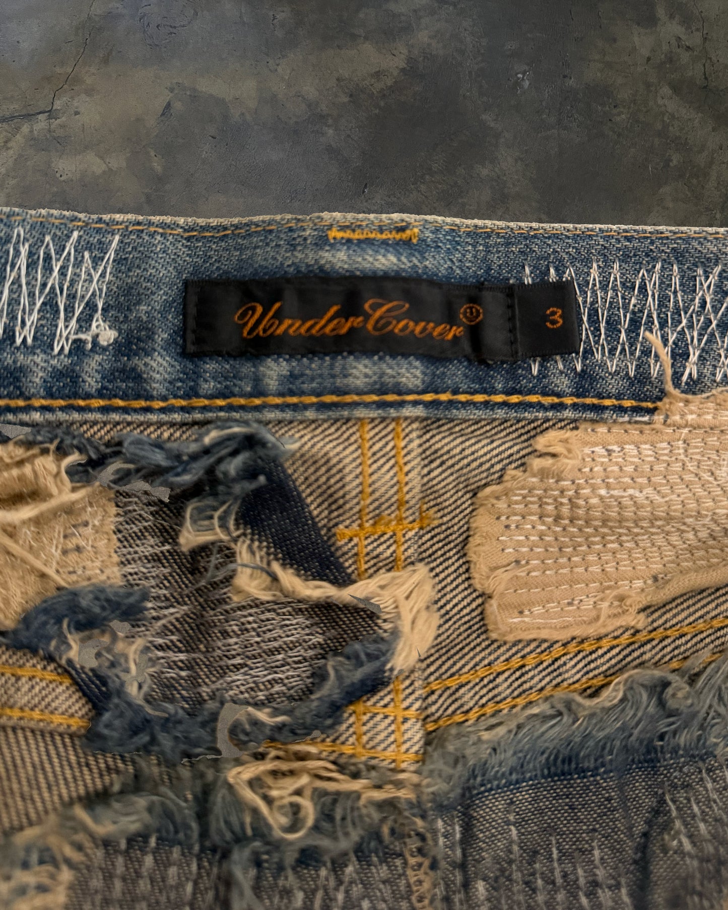 UNDERCOVER FW2005 RUNWAY 85 ARTS AND CRAFT JEANS